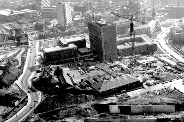 An aerial view showing the construction of Leeds Metropolitan University in April 1964. To the left, part of the old Harewood Barracks. Behind, the Civic Hall and car park. Woodhouse Lane on the left, Portland Way on the right.