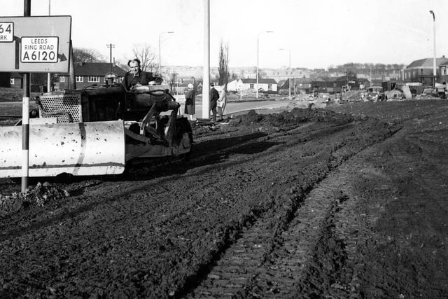February 1964 and a man drives a bulldozer taking part in construction work during the 1964 York Road Improvement period.