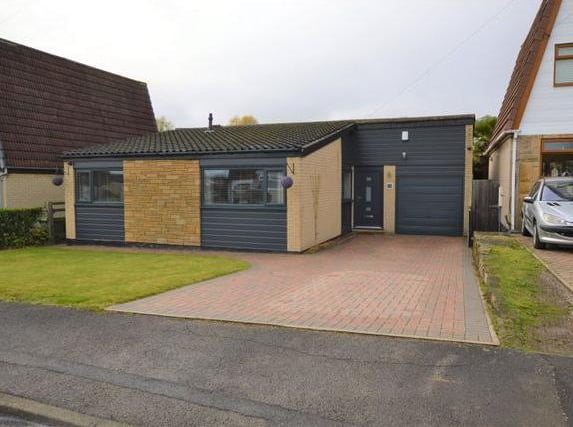 This 3-bedroom detached bungalow has an entrance porch and a modern fitted kitchen for just under 340,000 pounds