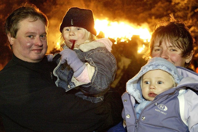 Roger Keeler, Isobel Keeler, 4, Emily Keeler, 10 months, and Katie Keeler at the Lightcliffe Scout bonfire back in 2005.