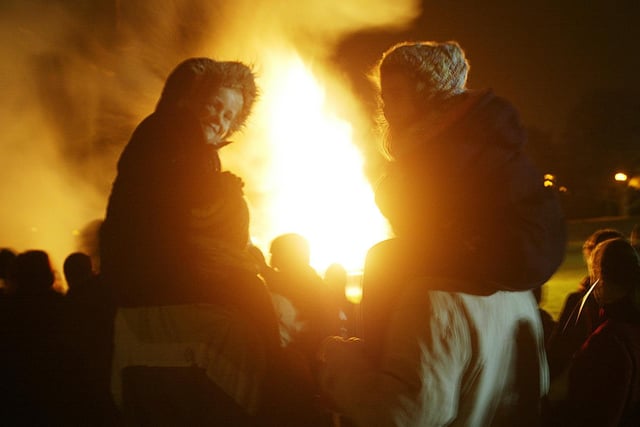 Benny Bentley with Ella Bentley, Six (left) and Neil Stephenson with Lucy Stephenson, six at the Elland bonfire in 2009.