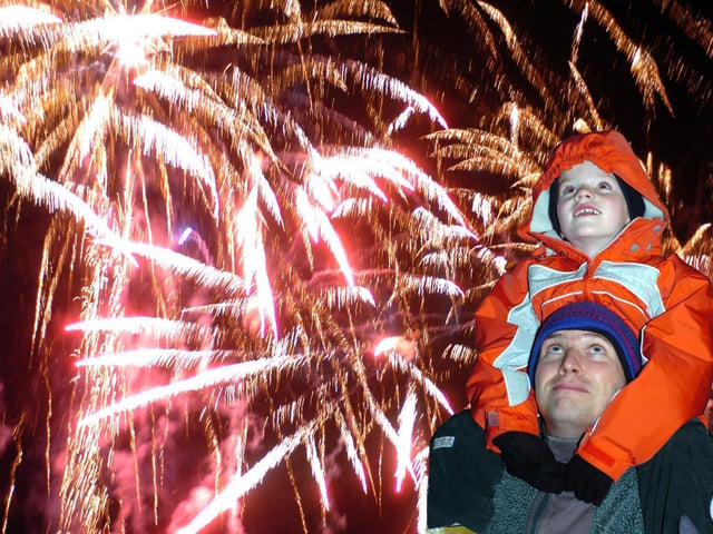 Andrew Wheeler of Horsforth, watches the Roundhay Park firework display with his son Joseph, six, in November 2005.