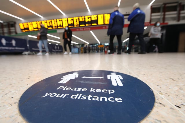 Social distance sign at Leeds train station at the start of a four week national lockdown for England.