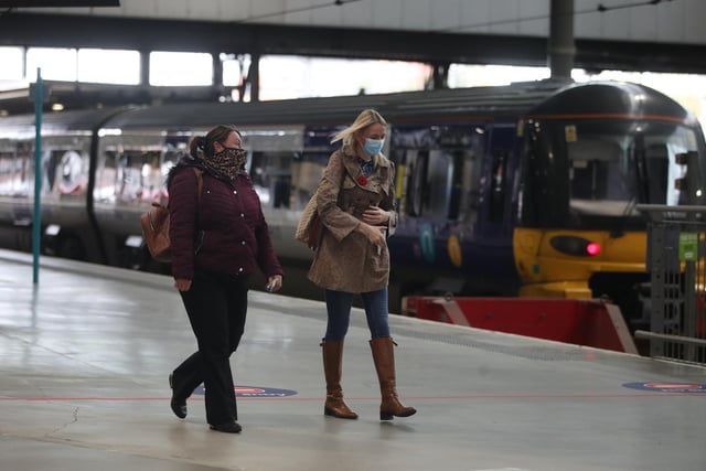 Two women on their morning commute at the station on Thursday