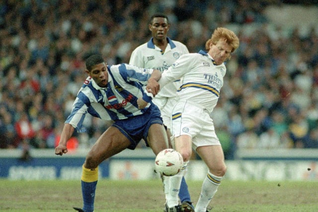 Gordon Strachan and former Whites midfielder Carlton Palmer battle for the ball during the game.