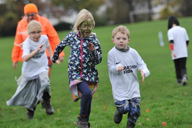 Children taking part in Marathon Kids, a fitness event with a Hallowe'en theme and a run around Astley Park, Chorley.