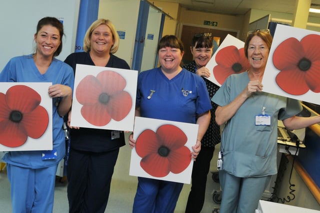 In 2018 we held a poppy campaign to asking people to display or pose with large red poppies for Remembrance Sunday.  Pictured are staff from Wigan Accident and Emergency, showing their support for the Wigan Observer Let's Turn The Town Red poppy campaign.