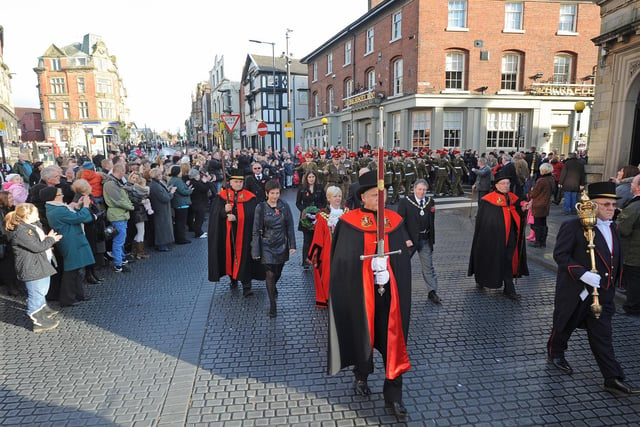Crowds gather to witness the annual Remembrance Sunday parade through Wigan town centre in 2012.