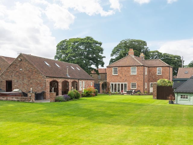 The property occupies a generous half acre plot