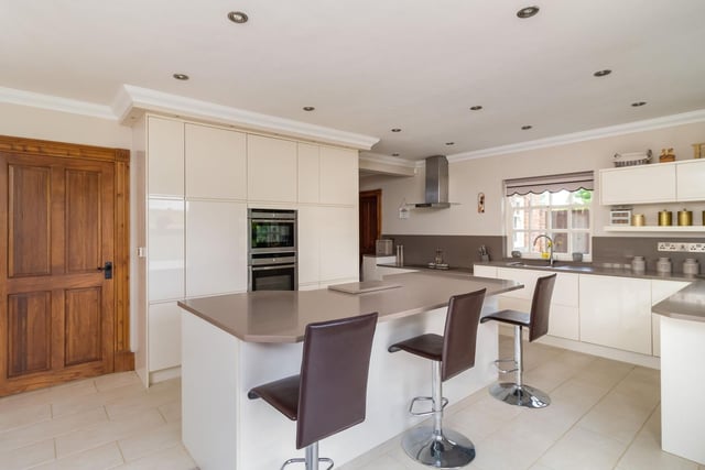 The spacious kitchen with breakfast bar