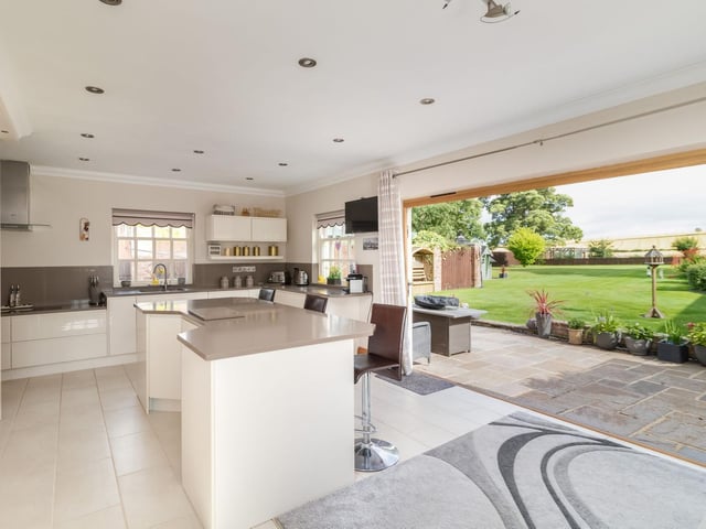 The large picture window offer views over open fields