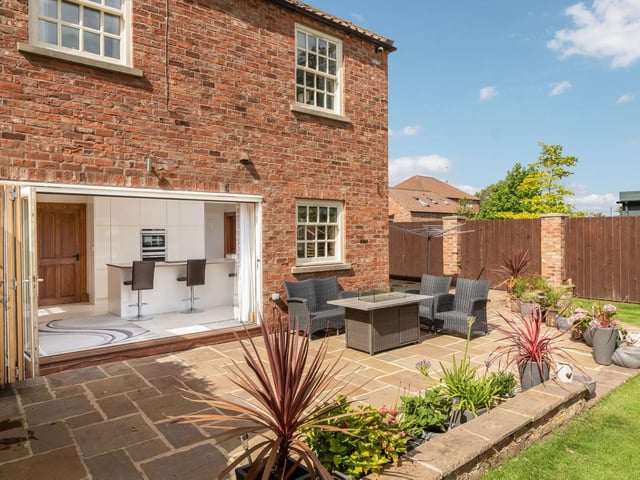 The bi-fold doors between the kitchen and garden create a fabulous free-flow design
