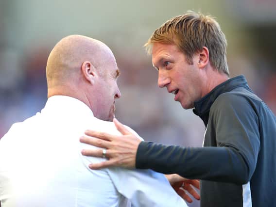 Graham Potter, Manager of Brighton and Hove Albion greets Sean Dyche, Manager of Burnley prior to the Premier League match between Brighton & Hove Albion and Burnley FC at American Express Community Stadium