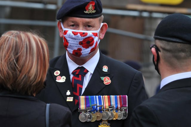 Face masks and social distancing were encouraged while wreaths were laid.