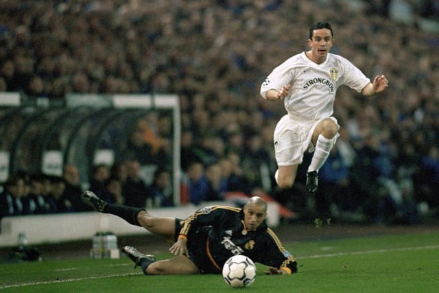 Leeds United 0 Real Madrid 2: Gary Kelly skips over Roberto Carlos as two goals in as many second-half minutes saw Los Blancos seal victory at Elland Road.