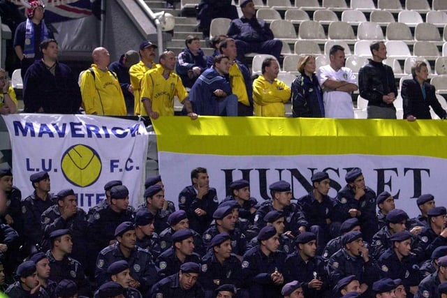 Besiktas 0 Leeds United 0: Leeds fans under a heavy police cordon during the game at the Inonu Stadium in Istanbul.