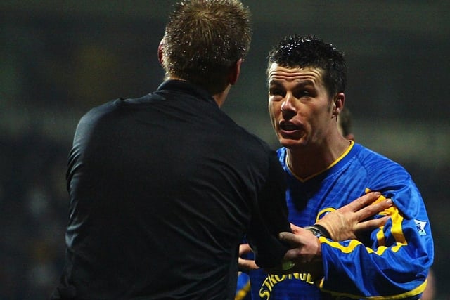Ian Harte makes his point to referee Graham Poll during the FA Barclaycard Premiership match against Bolton Wanderers at the Reebok Stadium in December 2002. Leeds won 3-0.
