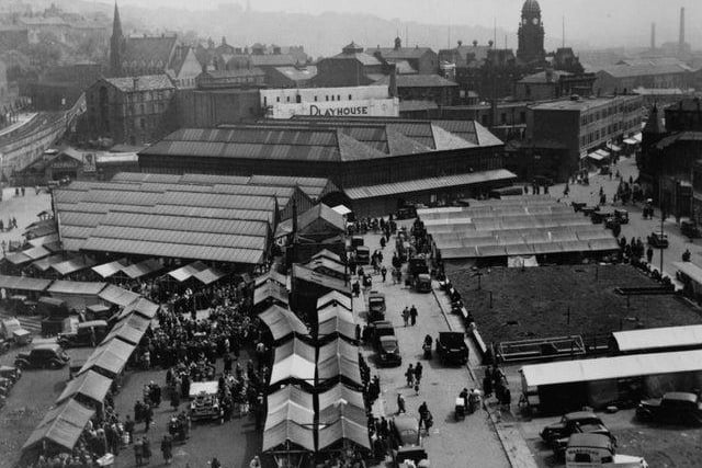 Dewsbury open air market with the station and town hall in the background in May 1947.