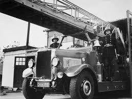 Members of Dewsbury Fire Brigade stand by a 22 year old turntable fire engine in December 1961. The fire engine saw service in Hull during the Nazi blitzes and was damaged by shrapnel.