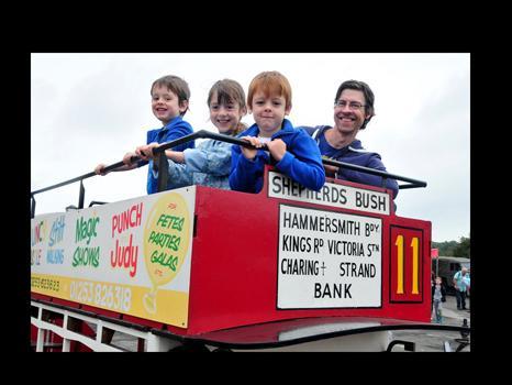 Olly, Daisy, Alfie and Lee Feeney aboard the open top bus at the Canal Fest held at Botany Bay to celebrate 200 years of the Leeds and Liverpool Canal.