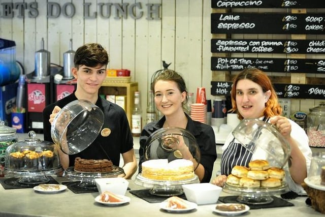 Max Southern, Imogen Fairhurst and Lyn Darbyshire of Cafe 1855 show off some of their cake at Botany Bay food and drink festival, Chorley