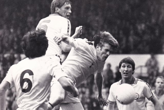 Centre half Neil Firm joins the Leeds United attack but heads wide against Tottenham Hotspur at Elland Road in September 1980.