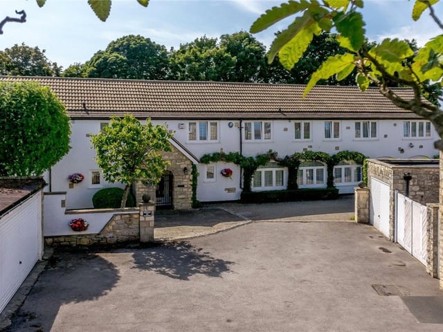 It has lawned gardens with mature borders and full length stone paved sun terrace with ornamental pond. At the bottom of the garden is a further stone paved terrace and circular pergola/covered seating area. It is on the market for £899,000 with Carter Jonas.