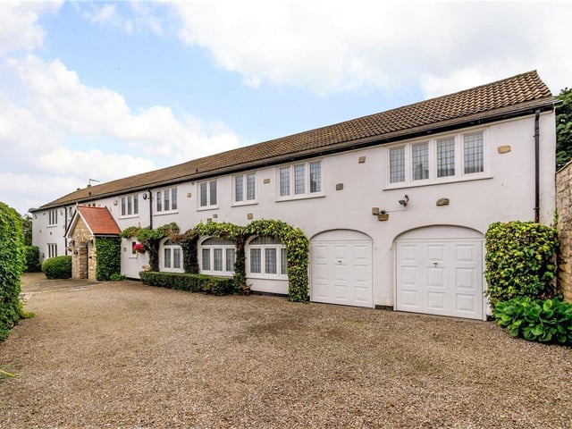 The Old Granary is in the picturesque village of Kirk Deighton, which sits on the border of Leeds and North Yorkshire. The house has a large, traditional kitchen and a feature staircase leading up to a galleried landing.