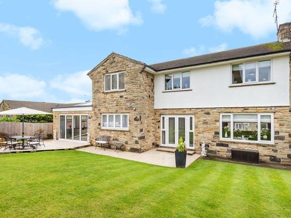 The detached Manley Drive home has four bedrooms, a large living area and two bathrooms with underfloor heating. It also has a practical dedicated utility room and a double garage with electric door and driveway for three cars.