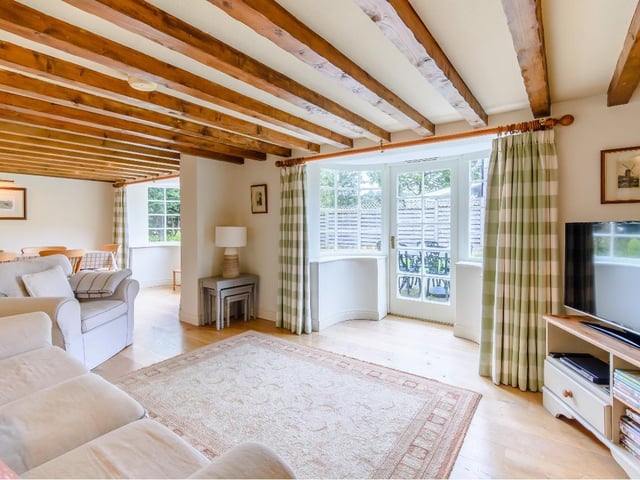 The large windows flood the room with light