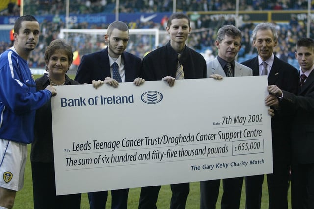 Gary Kelly presents a cheque - the proceeds of his charity game against Celtic - before the Premiership clash between Leeds United and Charlton Athletic at Elland Road in December 2002.