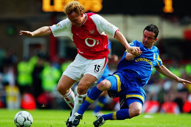 Ray Parlour tries shields the ball from Gary Kelly during the FA Barclaycard Premiership match at Highbury in May 2003. Leeds won 3-2.
