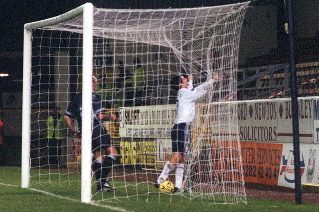 Jonathan Macken follows the ball into the net to celebrate scoring PNE's winner at Turf Moor in the Auto Windscreens Shield in December 1998