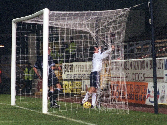 Jonathan Macken follows the ball into the net to celebrate scoring PNE's winner at Turf Moor in the Auto Windscreens Shield in December 1998