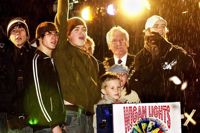 Top pop band of the day, McFly, switch on the Wigan Christmas lights watched by the Mayor of Wigan, Coun. John Hilton, on a snowy Saturday night in November 2004.