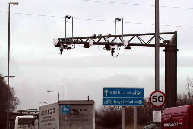 These overhead gantry carrying traffic charging equipment was being tested. It is passed by drivers entering Leeds from the south.
