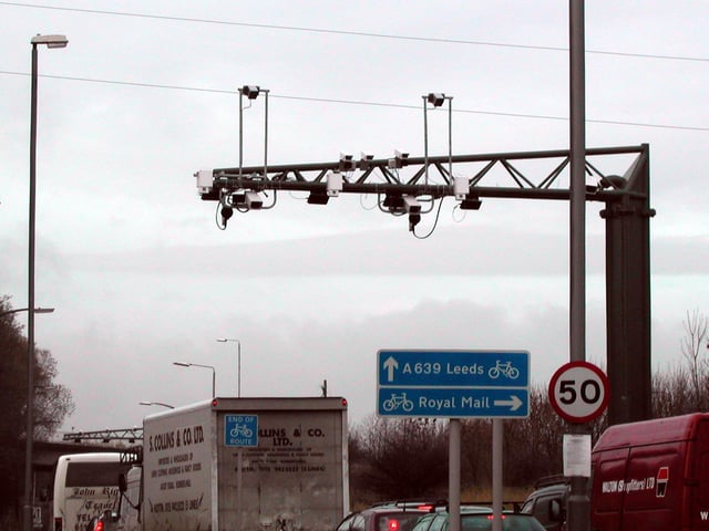 These overhead gantry carrying traffic charging equipment was being tested. It is passed by drivers entering Leeds from the south.
