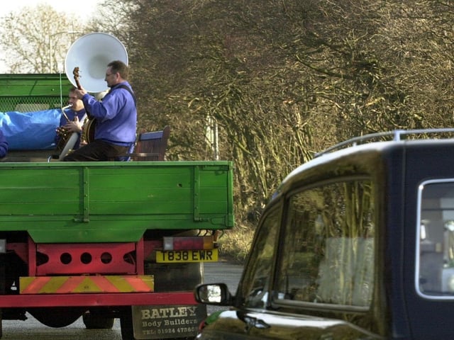 Winston's Pennine Jazz Band play on the back of a lorry at the head of the funeral procession for rag and bone man Eric Bailey.