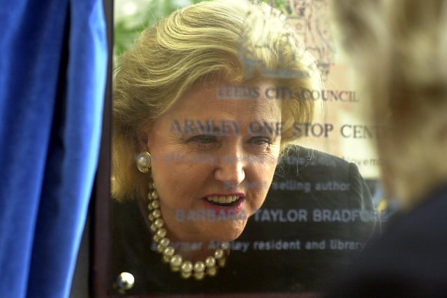 Author Barbara Taylor Bradford is reflected in the plaque after opening Armley One Stop Centre.