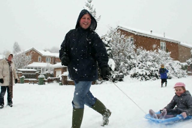 Mark and Emily Mosley have fun in the snow, outside from St James School, Crigglestone.
