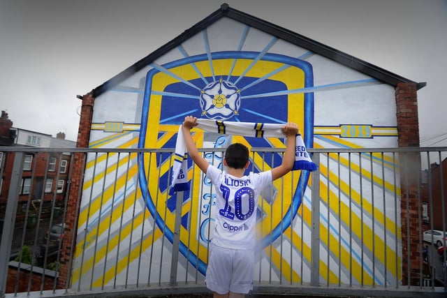 A little Leeds fan takes in the Holbeck mural (photo: Simon Hulme).