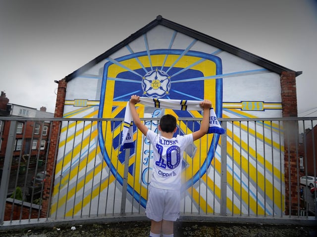 A little Leeds fan takes in the Holbeck mural (photo: Simon Hulme).