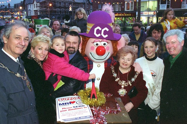 St Annes Christmas Lights, 1997. From left John Prestwich, Tracey Bishop with daughter Georgia (aged six) and husband Andy (from "Salter's Wharf", whose brewery Whitbread has donated £3,000 to the lights fund), Charlie Chalk, the Mayor of Fylde, Coun Dawn Prestwich, St. Annes Charity Carnival Queen - Debbie Marsden and TV personality Roy Walker.
