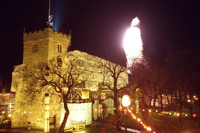 Fireworks burst over St Chad's Church in Poulton, to mark the switching-on of the town's Christmas lights, 1996