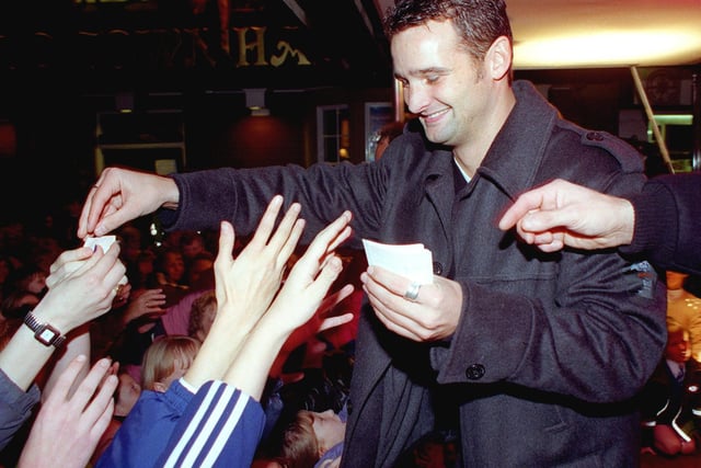 Poulton Christmas lights switch on,1998. Lottery millionaire Karl Crompton handing out free Lottery tickets