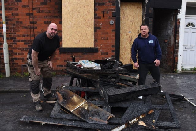 David Hardman, 50 (left) and Andy Wilson, 46, outside their neighbour's fire ravaged home in Boundary Street, Leyland where they rescued a young mum and her 12-year-old son yesterday afternoon (November 19)