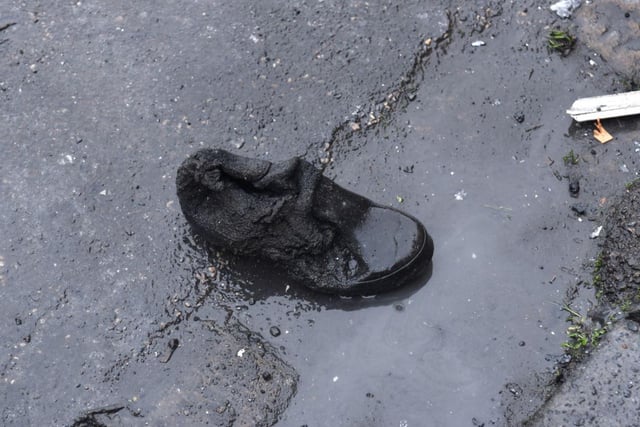A partially melted shoe found outside the home this morning (November 20)