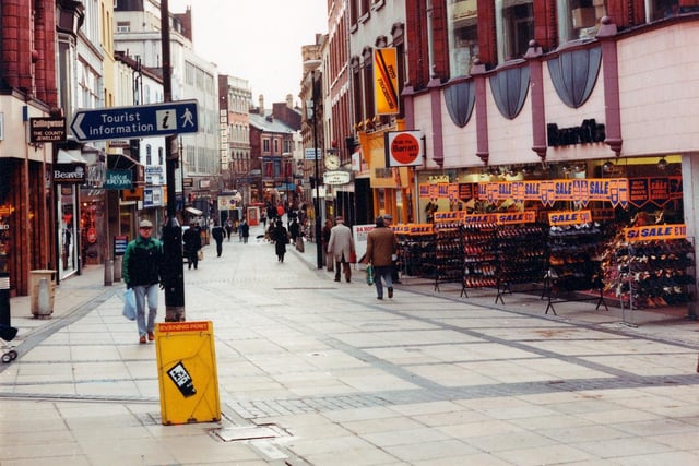 September 1982 and pictured is Commercial Street looking towards Briggate and across the junction with Briggate to Kirkgate. On the right Barratts shoe shop is holding a sale