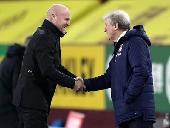 Burnley's English manager Sean Dyche (L) greets Crystal Palace's English manager Roy Hodgson (R) ahead of the English Premier League football match between Burnley and Crystal Palace at Turf Moor in Burnley, north west England on November 23, 2020.