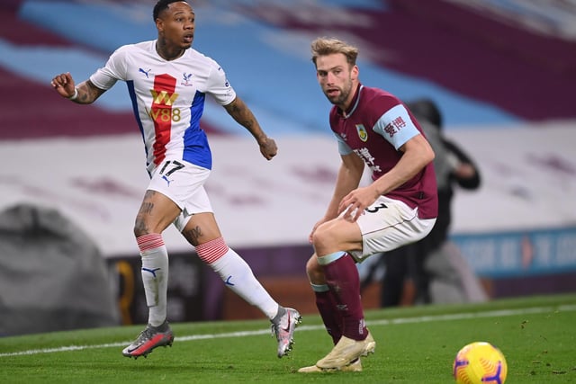 Nathaniel Clyne of Crystal Palace is challenged by s of Burnley during the Premier League match between Burnley and Crystal Palace at Turf Moor on November 23, 2020 in Burnley, England.